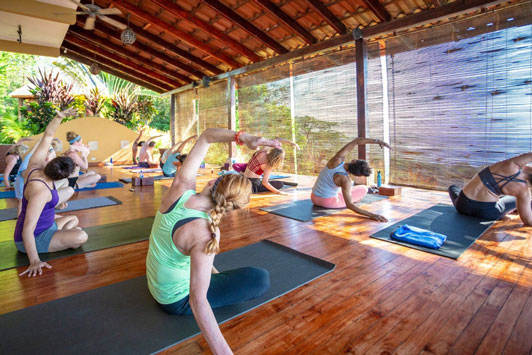 yoga on the deck at Anamaya